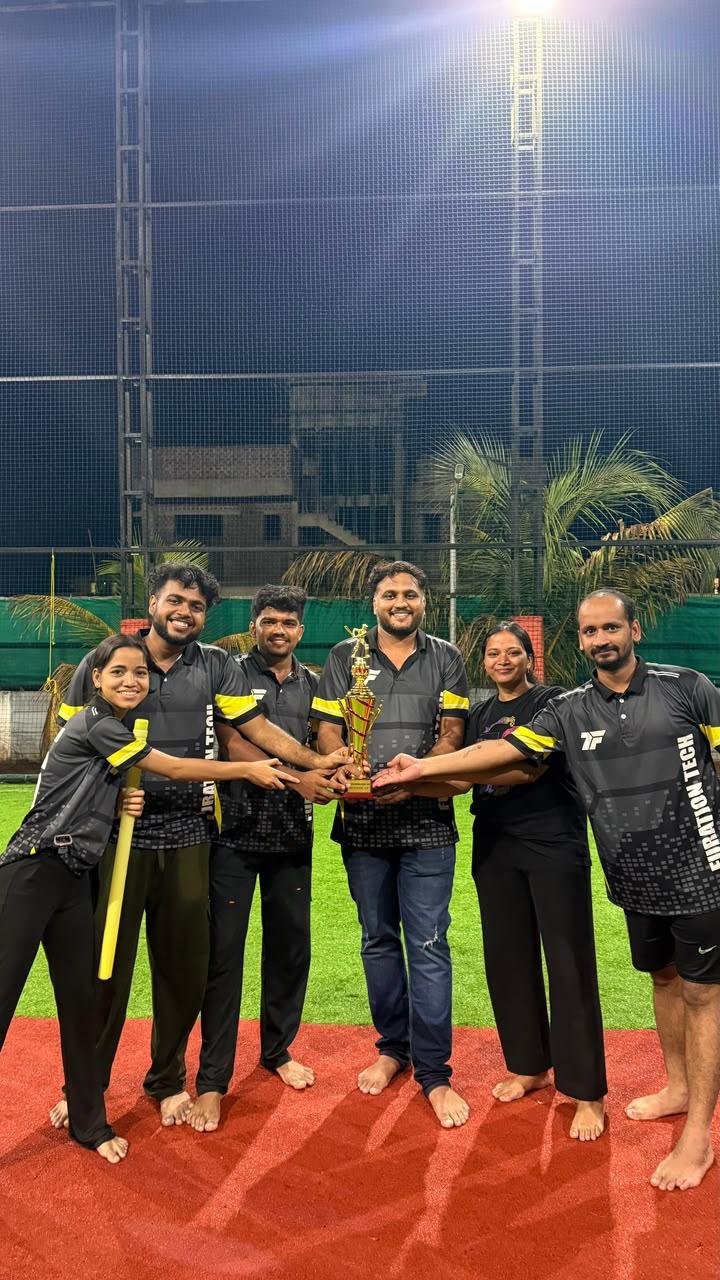Sports turf winners holding trophy